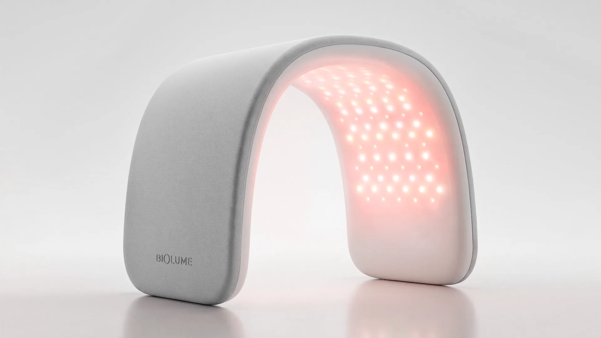 Biolume arched LED light therapy device standing on its own with the red light array on