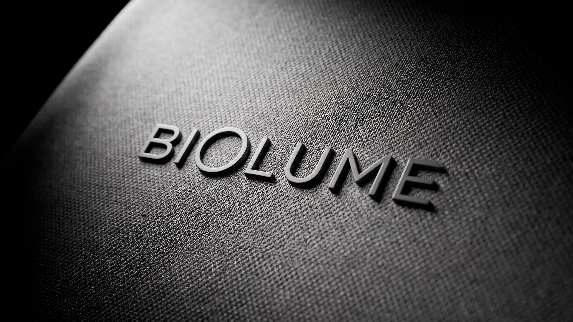 Biolume logo embossed in dark textile