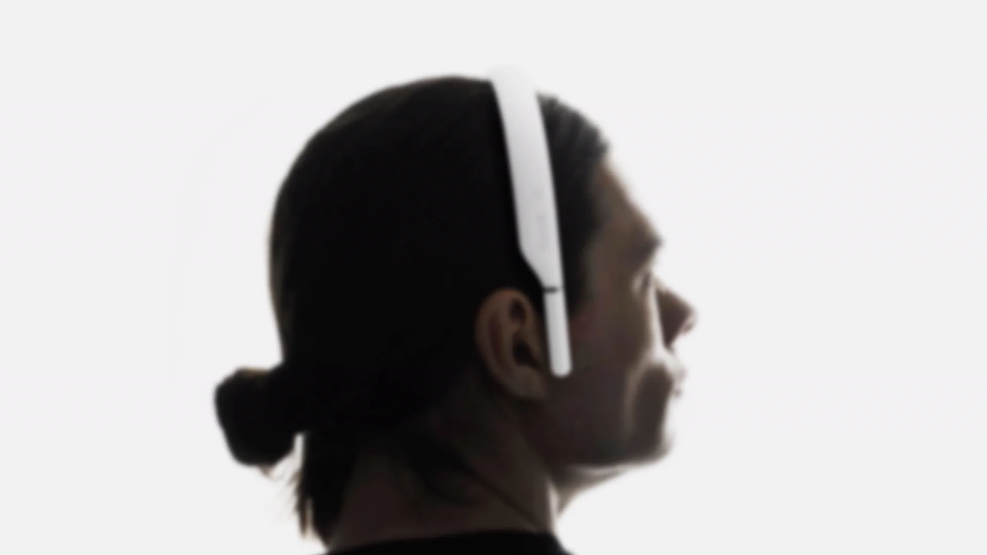 Person wearing a head-mounted device, project under wraps