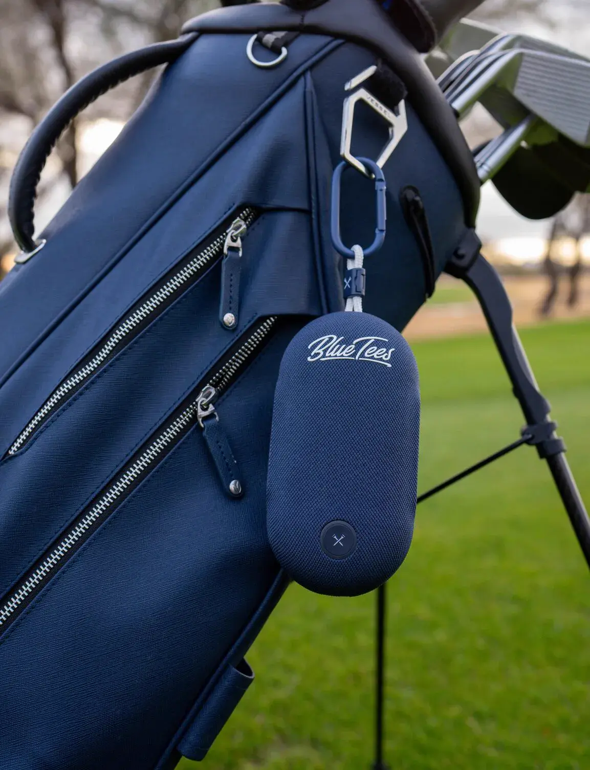 PlayerGo attached to a golf bag with a carabiner