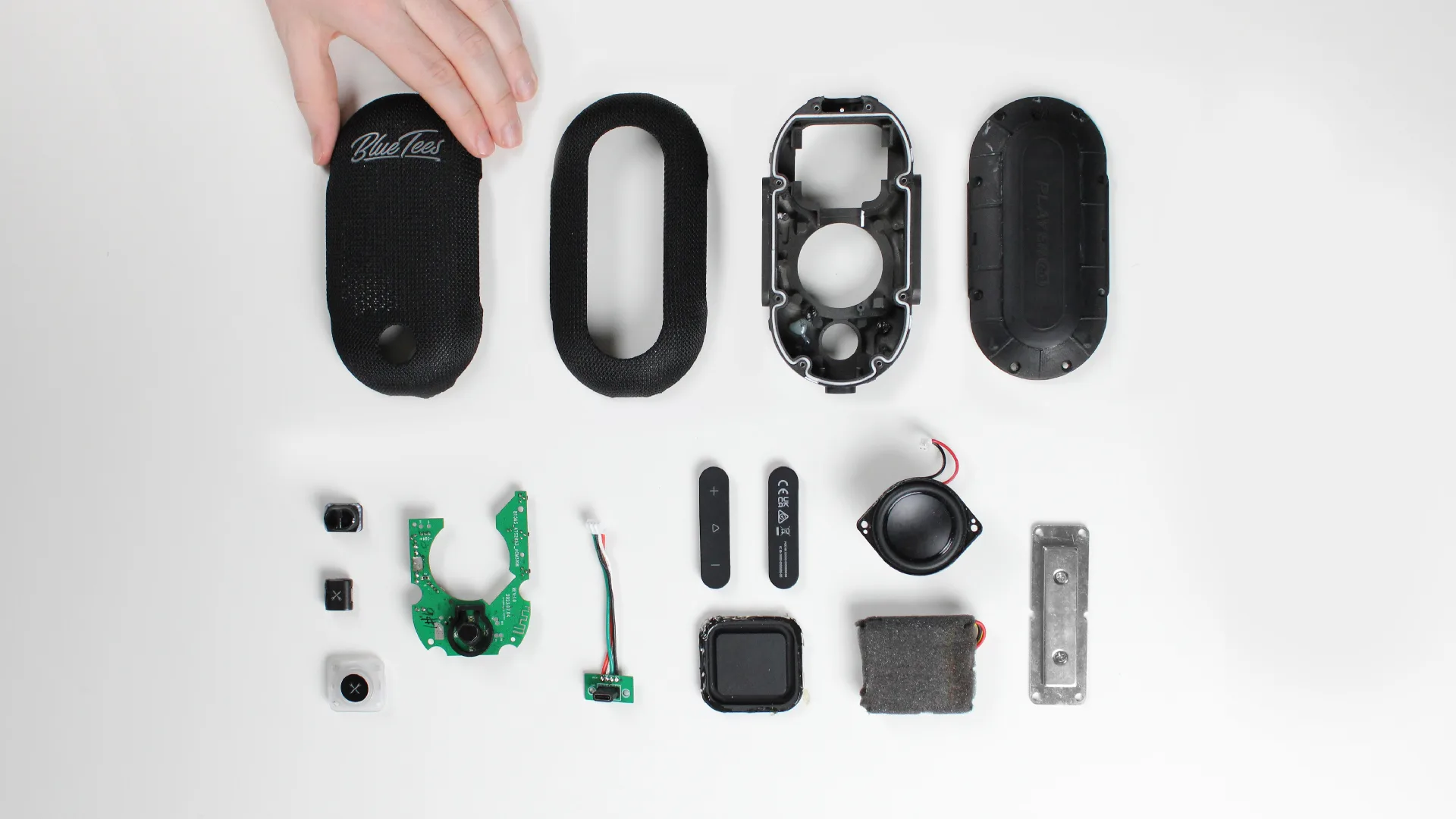 PlayerGo speaker disassembled into its housing, driver, and electronics