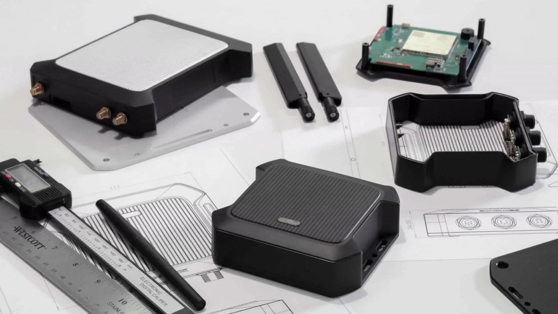 Syncwise device housing parts, antennas, and circuit board on a desk